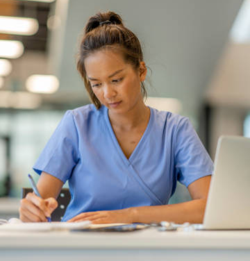 Nurse writing down notes.