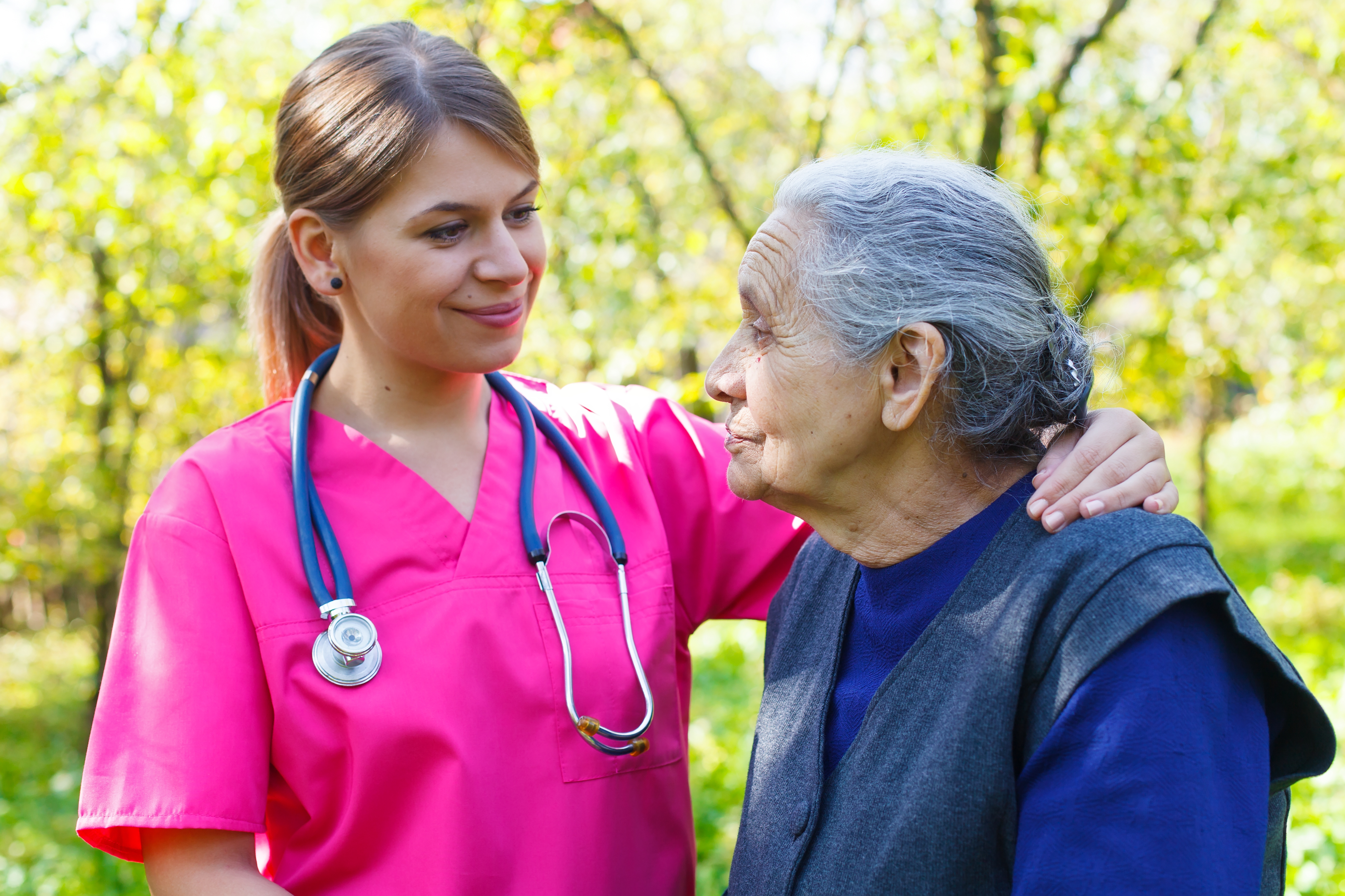 Nurse and patient outdoors