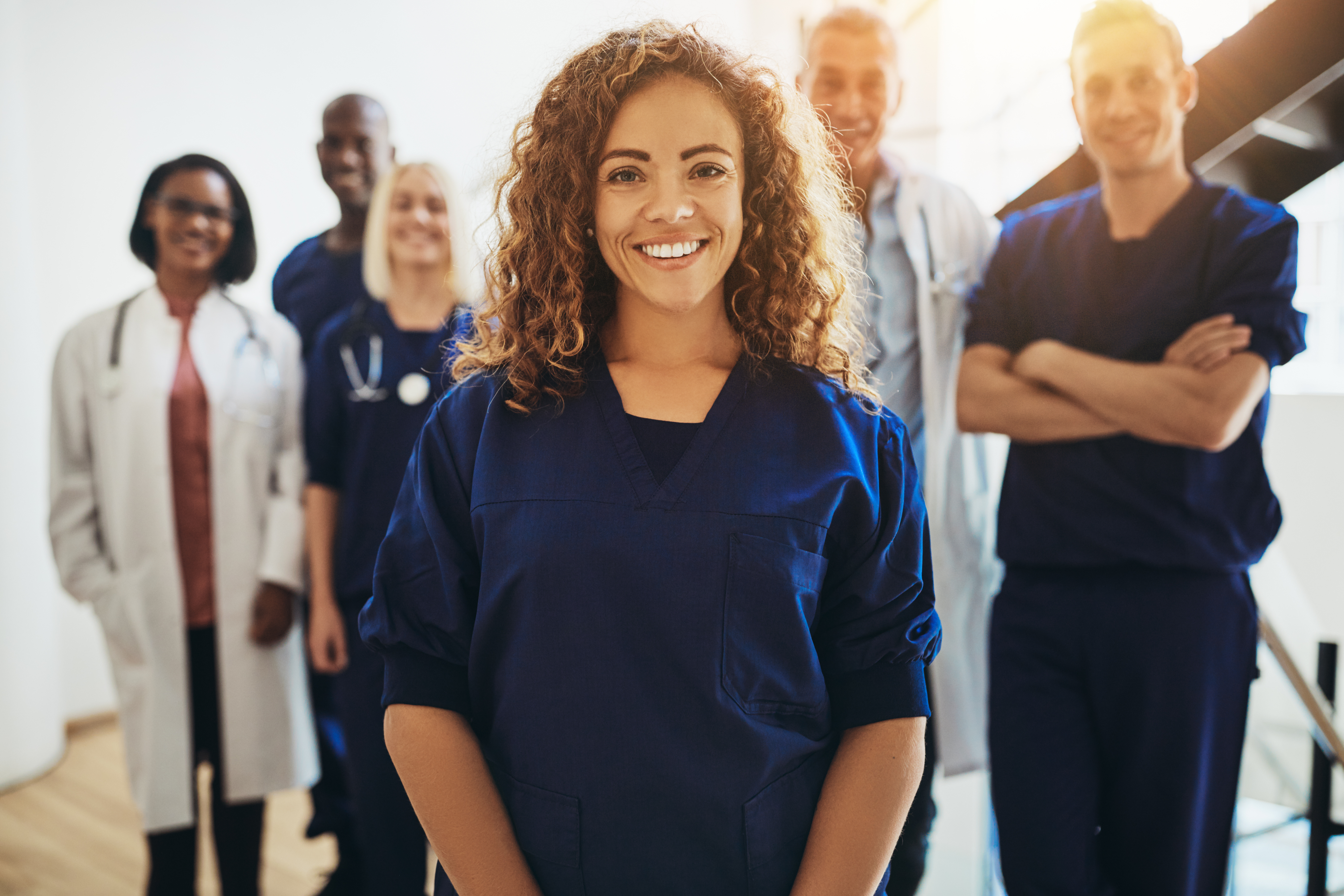 FemaleNurseStandingInGroup