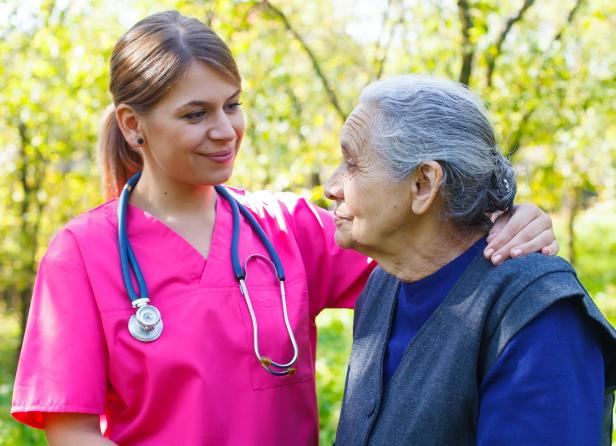 Nurse and patient outdoors